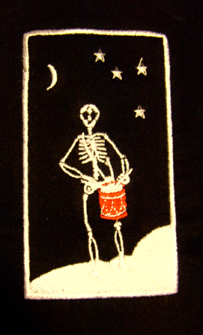 Detail on skeleton drummer T shirt